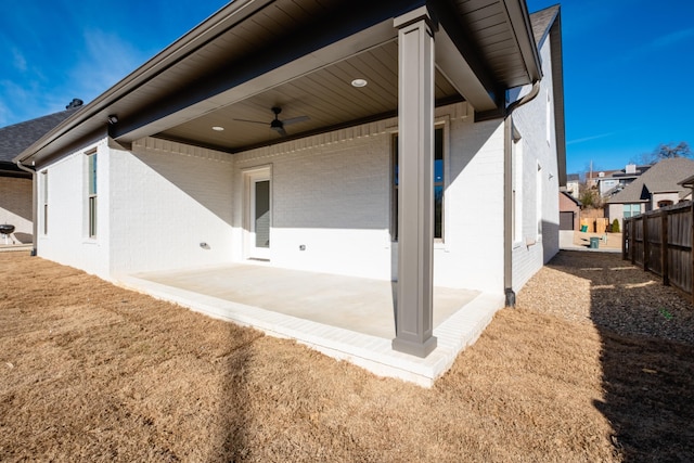 exterior space featuring ceiling fan, a patio, and a lawn