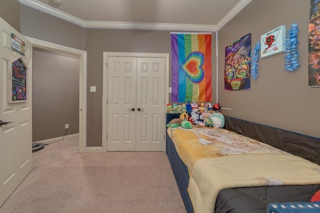 bedroom with crown molding, a closet, and carpet flooring