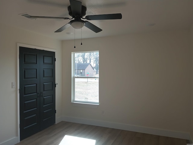 entrance foyer with hardwood / wood-style flooring and ceiling fan