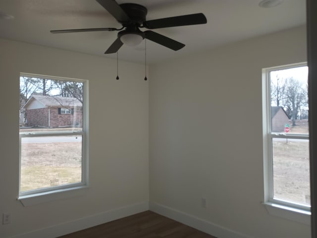 spare room featuring dark wood-type flooring