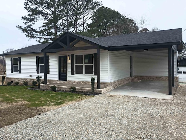 view of front of property featuring a carport