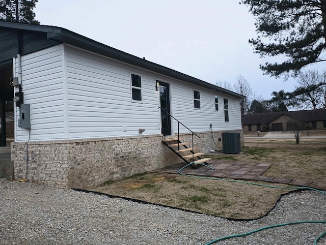 rear view of house with cooling unit