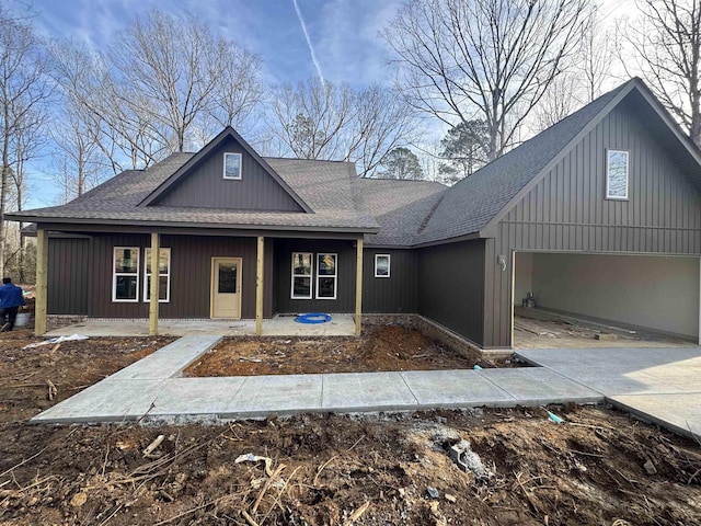 view of front of home featuring a garage and a porch