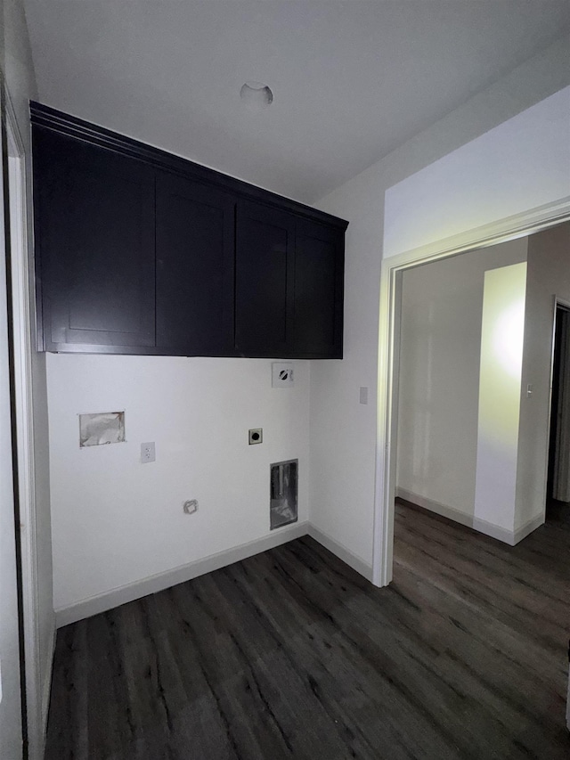 laundry room featuring hookup for a gas dryer, cabinet space, dark wood-type flooring, hookup for an electric dryer, and baseboards