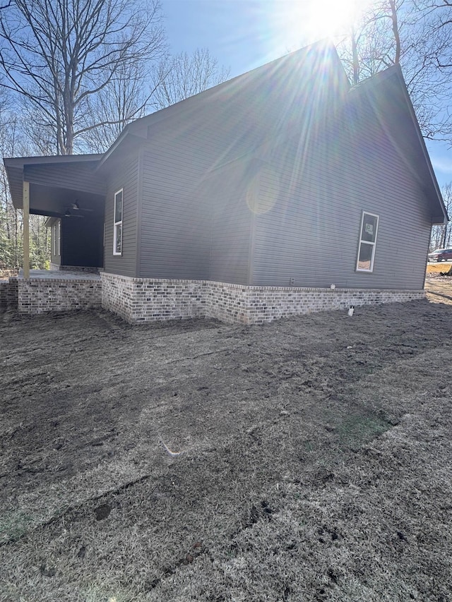 view of side of home featuring a carport