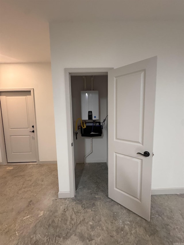 5389 Pear Orchard Dr, Little Rock, AR 72206 - hall featuring baseboards and water heater
