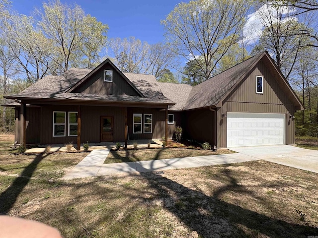 5389 Pear Orchard Dr, Little Rock, AR 72206 - view of front of property with concrete driveway, a shingled roof, and a garage