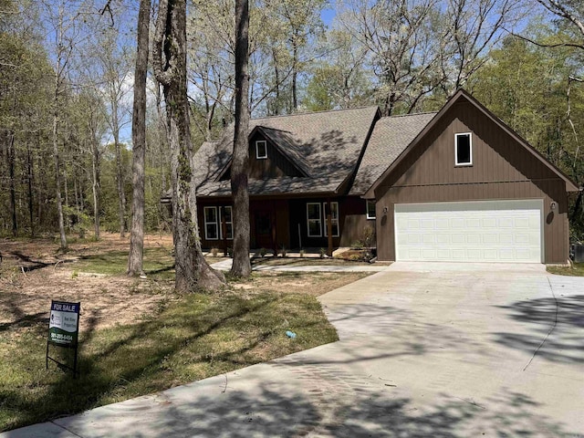 5389 Pear Orchard Dr, Little Rock, AR 72206 - view of front of house with an attached garage and concrete driveway
