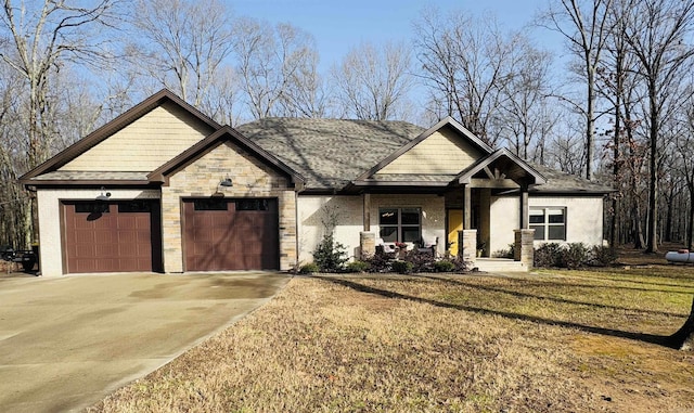 view of front of property with a garage and a front yard