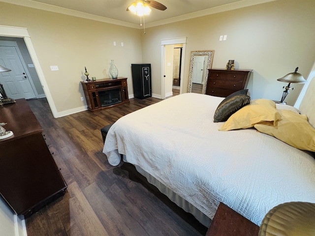 bedroom featuring crown molding, ceiling fan, and dark hardwood / wood-style floors