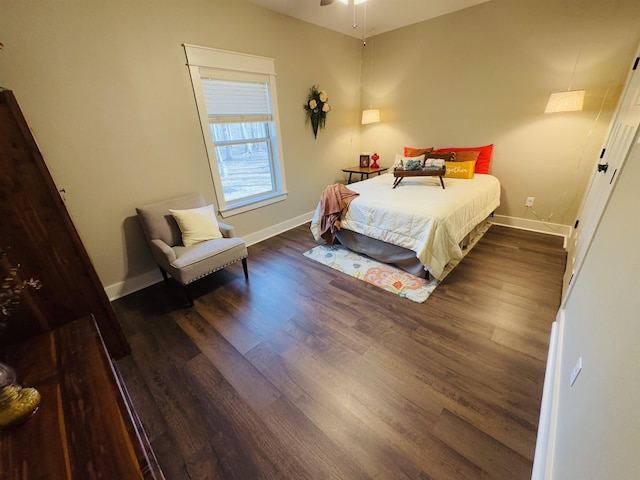 bedroom with dark hardwood / wood-style flooring