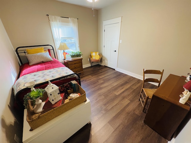 bedroom featuring dark hardwood / wood-style flooring