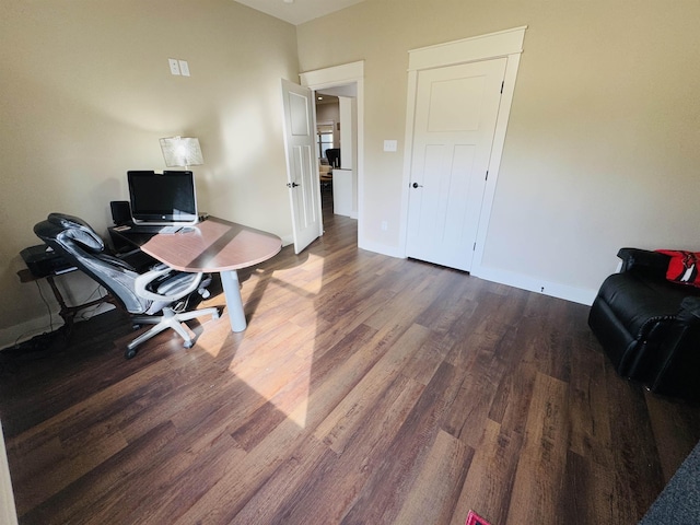 office with dark hardwood / wood-style flooring