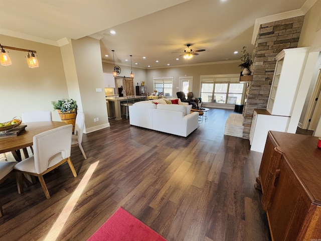 living room featuring dark hardwood / wood-style flooring, ornamental molding, and ceiling fan