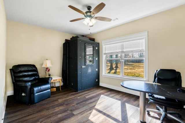home office featuring dark hardwood / wood-style flooring and ceiling fan