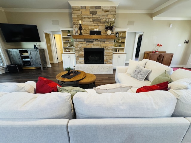 living room featuring crown molding, a fireplace, and dark hardwood / wood-style flooring