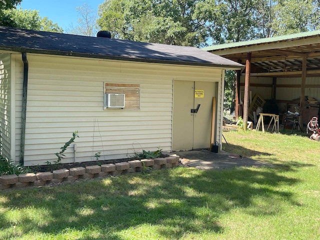 view of outbuilding featuring a yard