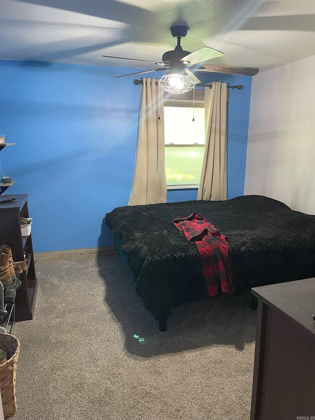 bedroom featuring ceiling fan and carpet floors