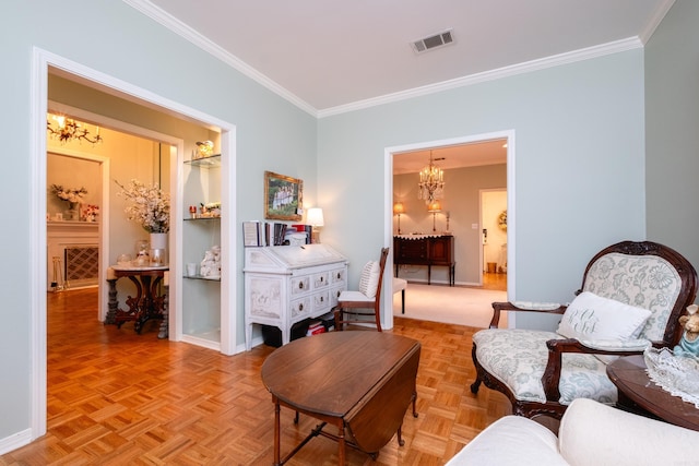 sitting room featuring an inviting chandelier, light parquet flooring, and crown molding