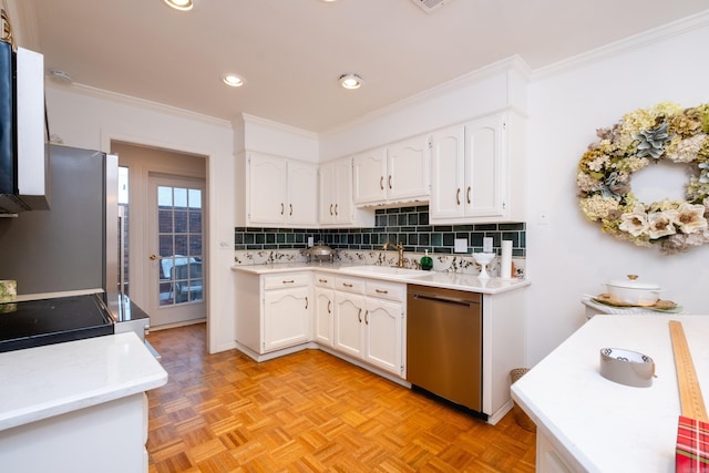 kitchen featuring sink, light parquet floors, appliances with stainless steel finishes, ornamental molding, and white cabinets