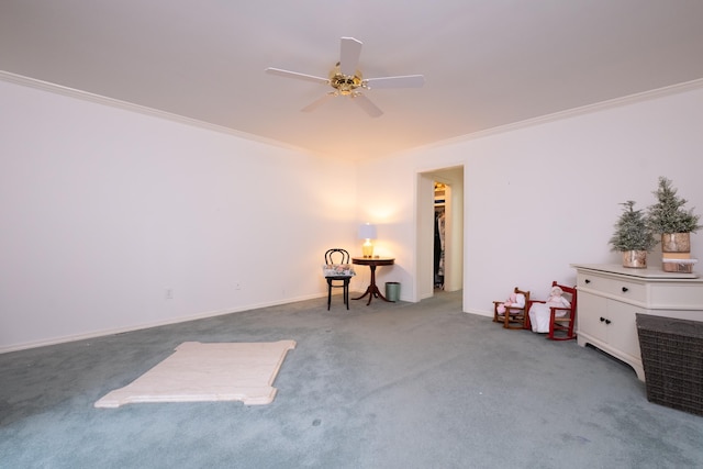 carpeted empty room with ornamental molding and ceiling fan