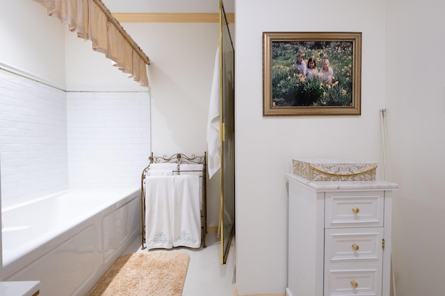 bathroom featuring vanity and a bath