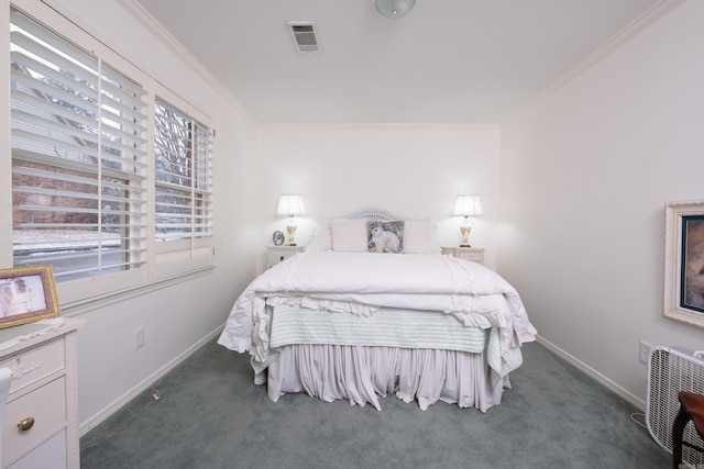 bedroom featuring dark carpet and ornamental molding