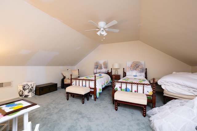 carpeted bedroom with vaulted ceiling and ceiling fan