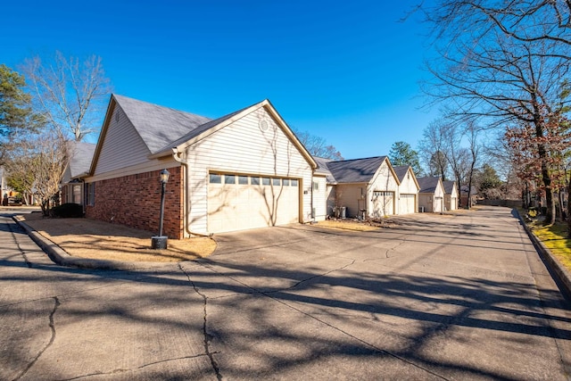 view of side of home featuring a garage