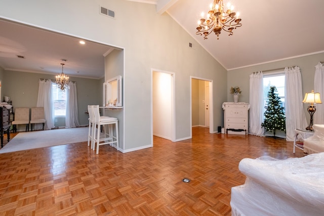 living room featuring light parquet flooring, ornamental molding, high vaulted ceiling, and a chandelier