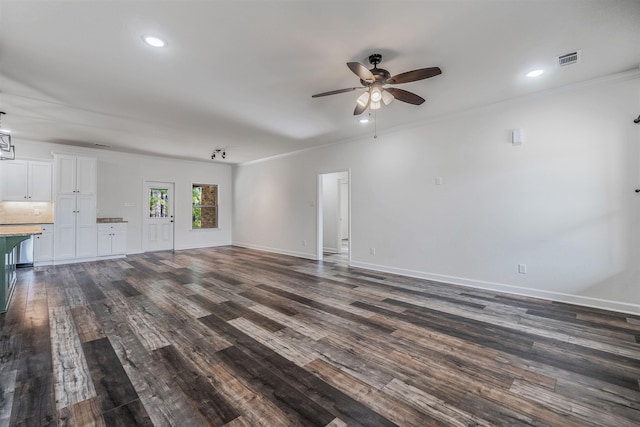 unfurnished living room with ceiling fan, ornamental molding, and dark hardwood / wood-style flooring