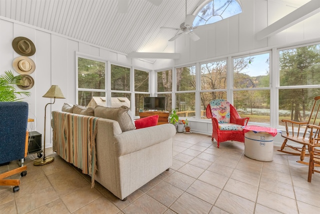 sunroom / solarium with lofted ceiling, a wealth of natural light, and ceiling fan