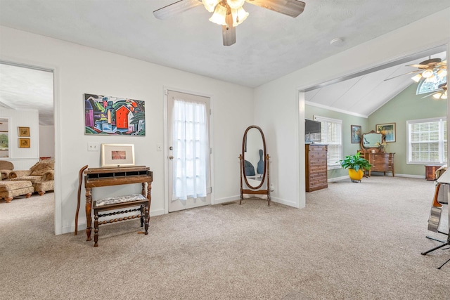 interior space featuring light carpet, lofted ceiling, and ceiling fan