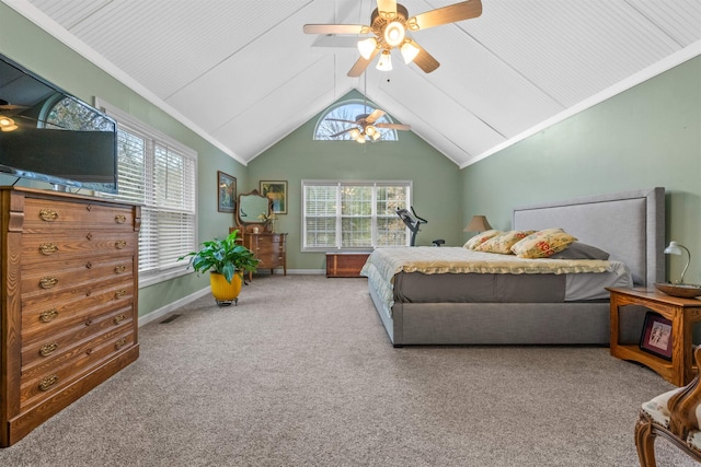 carpeted bedroom with multiple windows, vaulted ceiling, ornamental molding, and ceiling fan