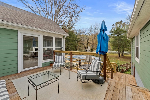 wooden deck featuring a sunroom