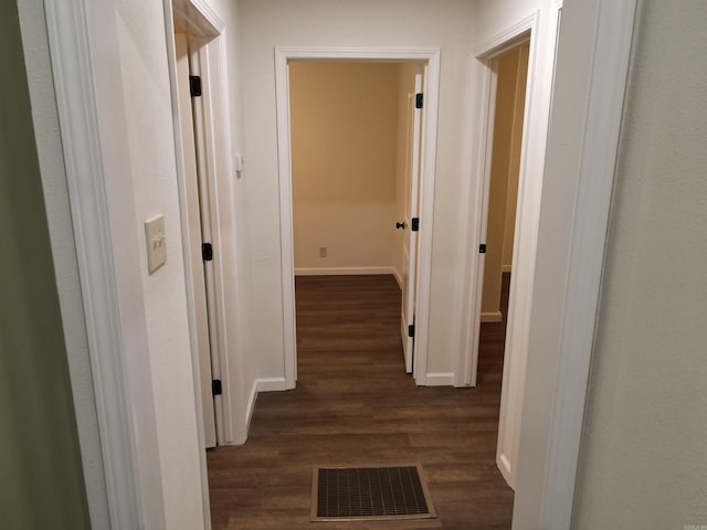 hallway featuring dark hardwood / wood-style floors