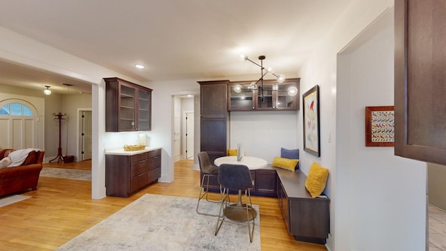 dining room with a notable chandelier and light hardwood / wood-style flooring