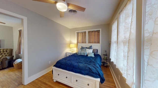 bedroom featuring light hardwood / wood-style floors and ceiling fan