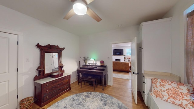 interior space with ceiling fan and light wood-type flooring