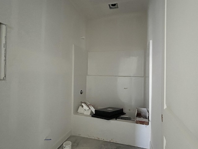 bathroom featuring concrete flooring