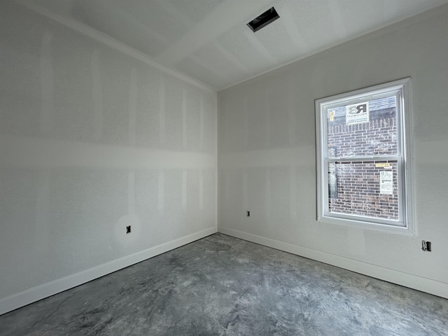 spare room with concrete flooring