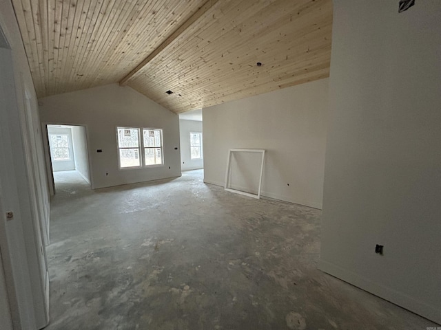 interior space featuring wood ceiling, concrete flooring, high vaulted ceiling, and beam ceiling