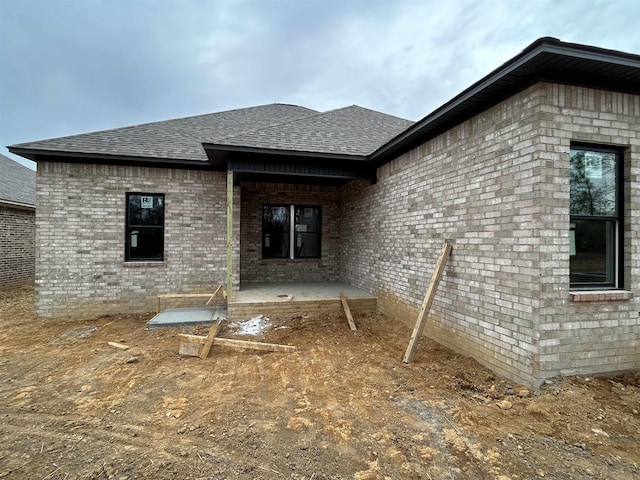 back of house with a patio