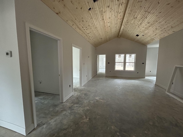 unfurnished living room with wooden ceiling, high vaulted ceiling, and concrete floors