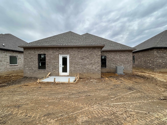 rear view of property featuring a patio and central AC unit