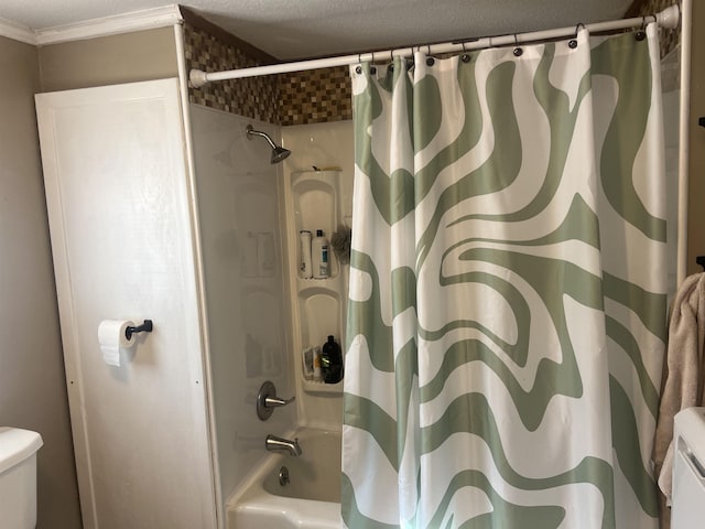 bathroom with ornamental molding, shower / bathtub combination with curtain, a textured ceiling, and toilet