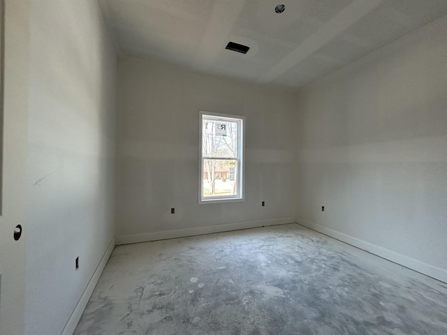 unfurnished room with baseboards