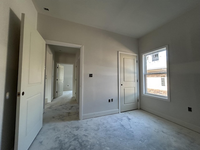 unfurnished bedroom featuring baseboards