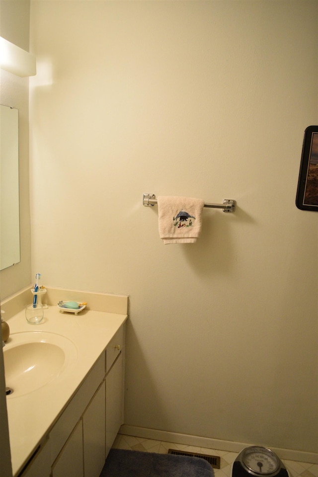 bathroom with tile patterned floors and vanity