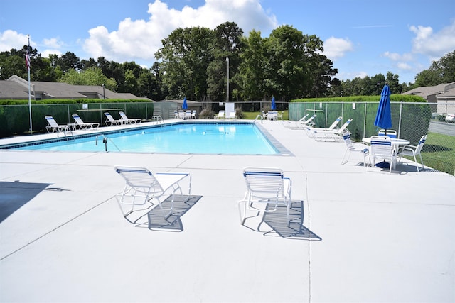 view of swimming pool with a patio